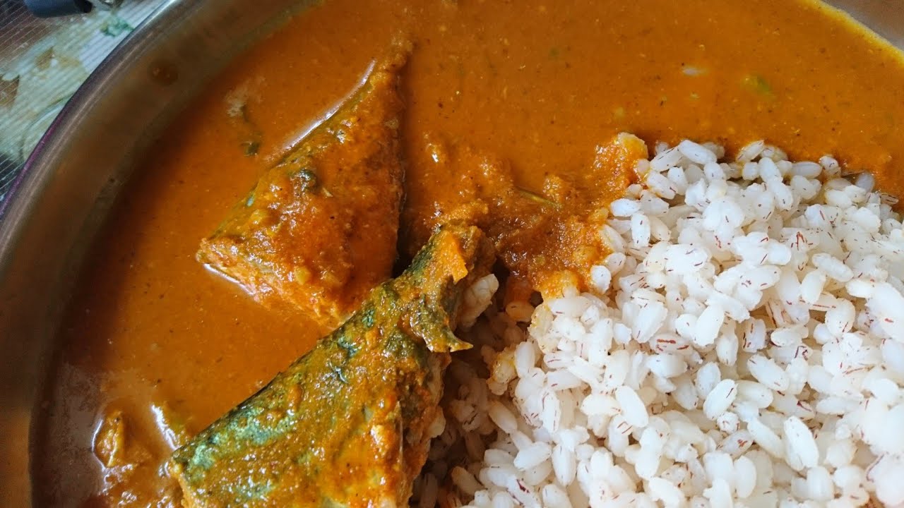 Fish Gassi, fish curry in rich coconut gravy served with boiled rice