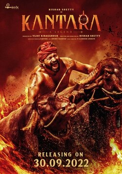 Kantara 2022 theatrical poster showing Rishab Shetty before a charging buffalo, releasing 30 September 2022