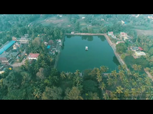 Aerial view of the temple lake at Koteshwara surrounded by the town