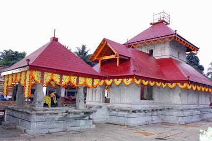 The red-roofed Mahalingeshwara Shiva temple at Basrur decorated with marigold garlands